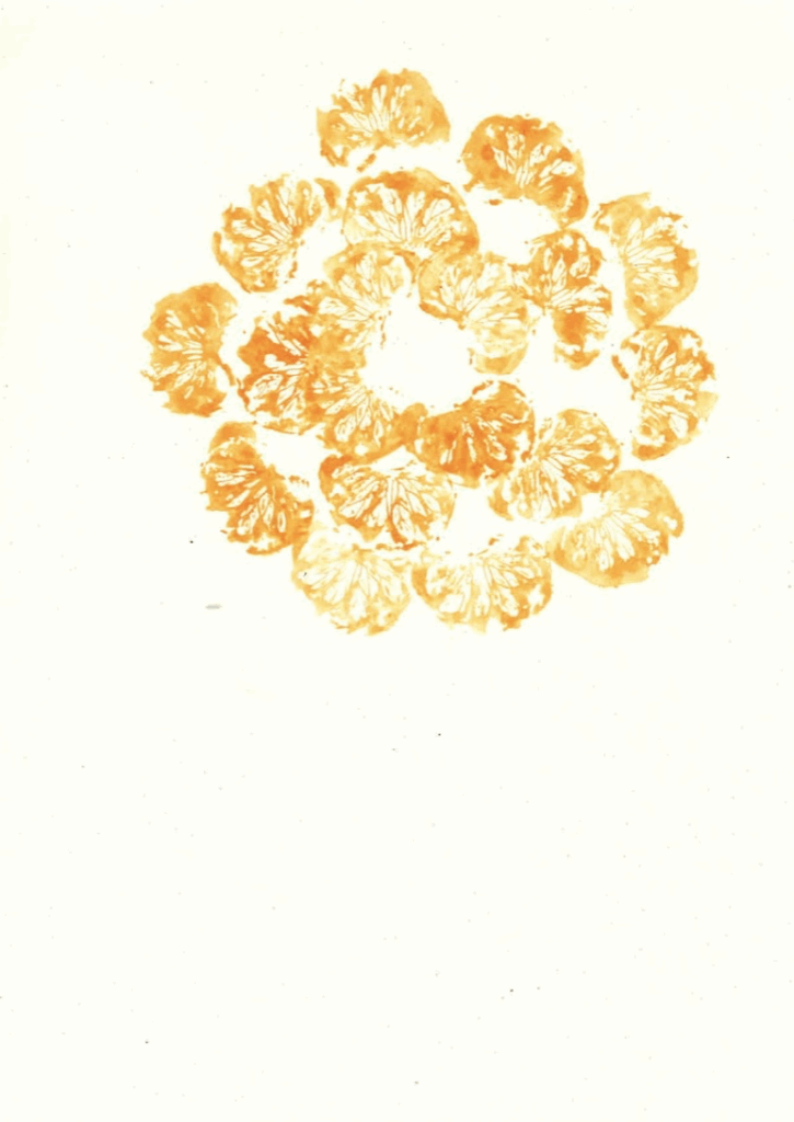 gold tangerine stamps in a multilayered circle